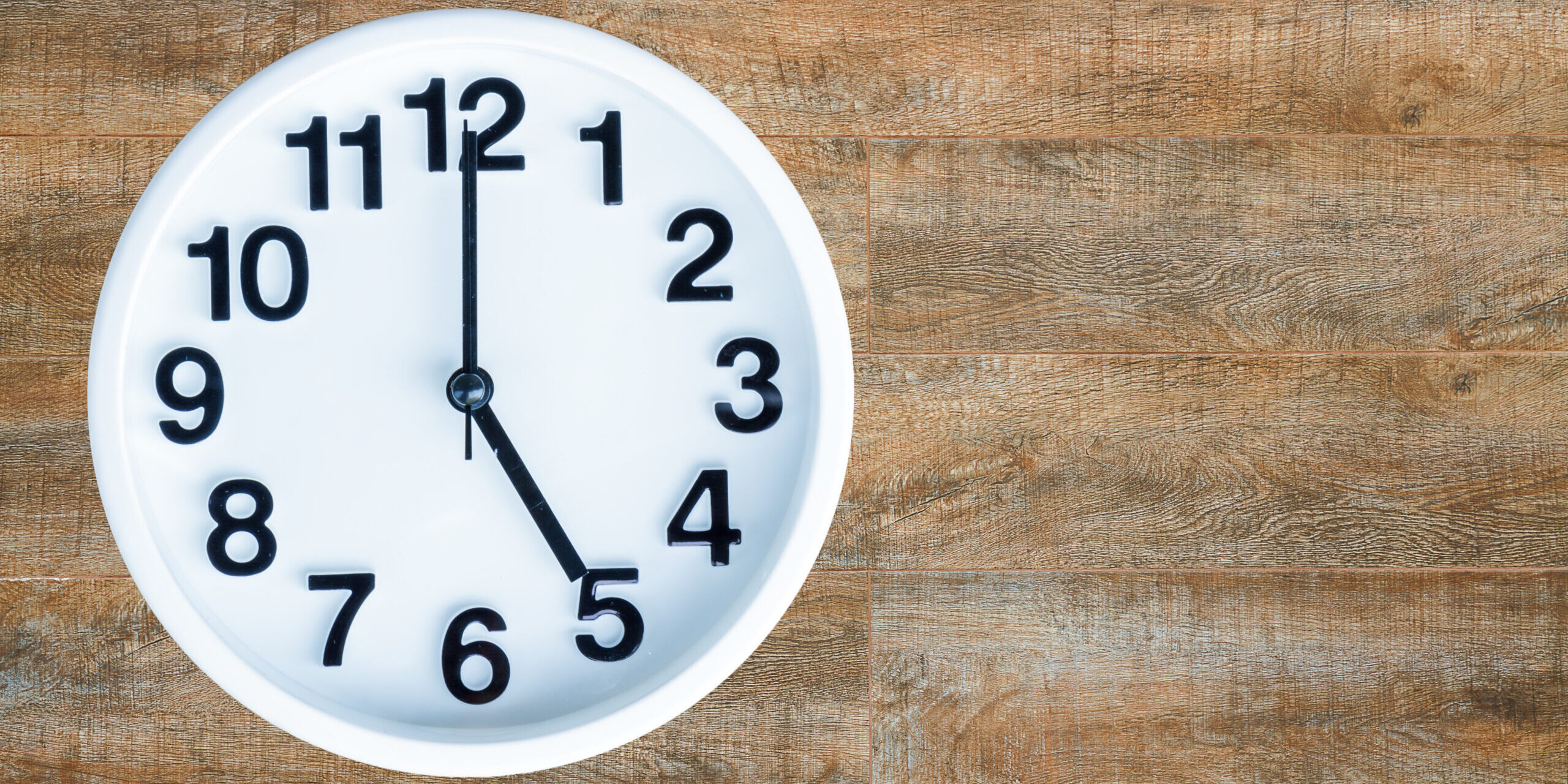 Clock on wood background